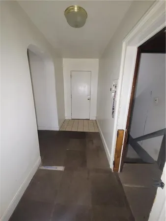 a view of a hallway with a window