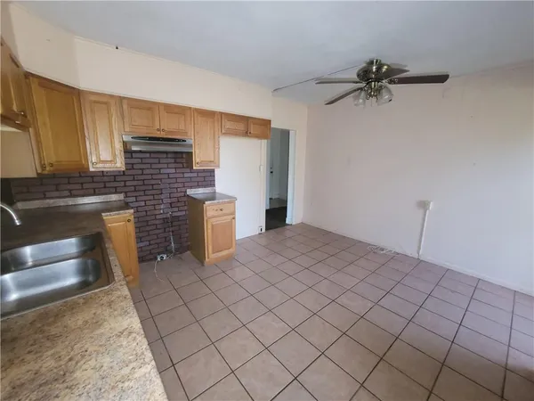 a room with a bed and cabinets
