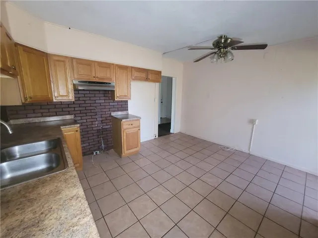 a room with a bed and cabinets