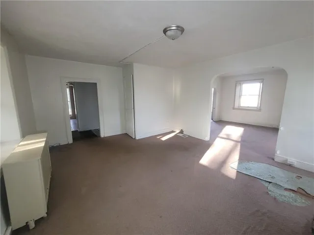 a view of empty room with windows