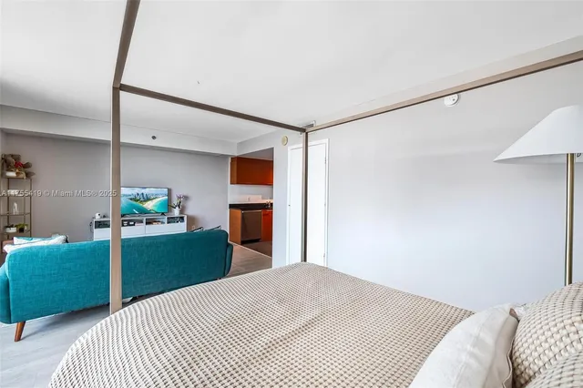 a bedroom with a bed and a cabinets