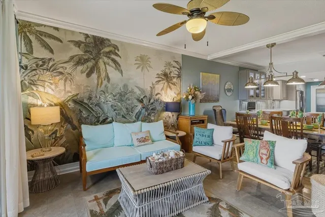 a living room with furniture and a chandelier