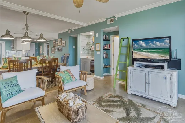 a living room with furniture and a flat screen tv