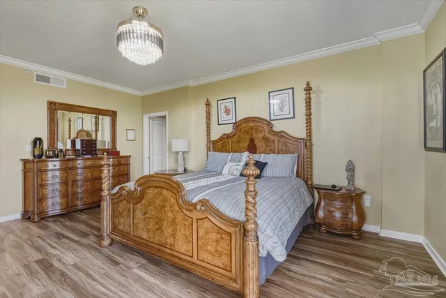 a bed room with a bed and dresser