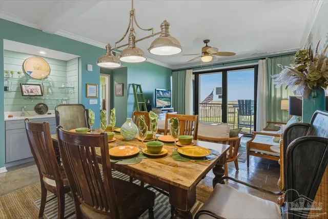 a view of a dining room with furniture window and outside view