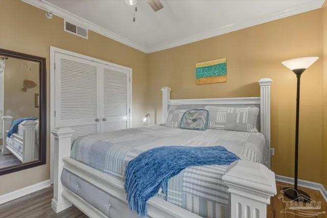 a bedroom with a bed and dresser