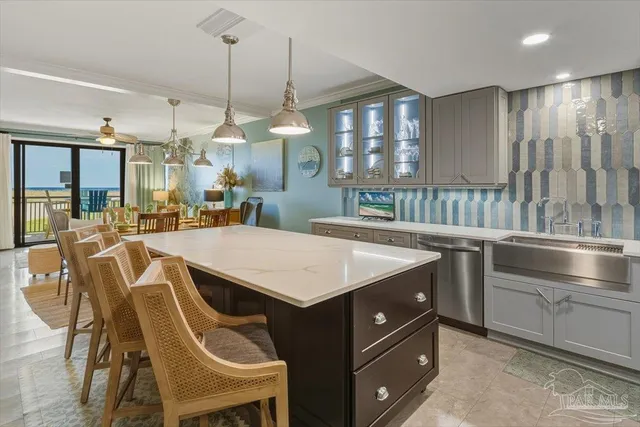 a kitchen with a table chairs and white cabinets