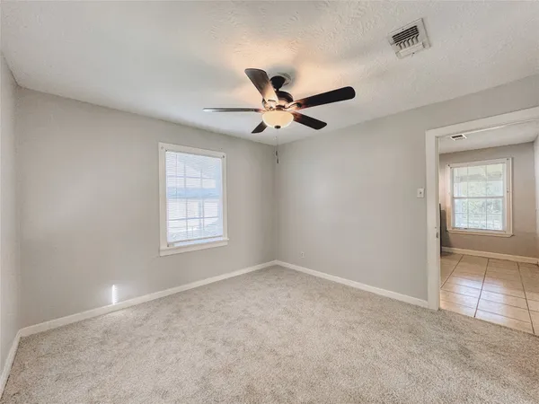 a spacious bathroom with a sink mirror and vanity