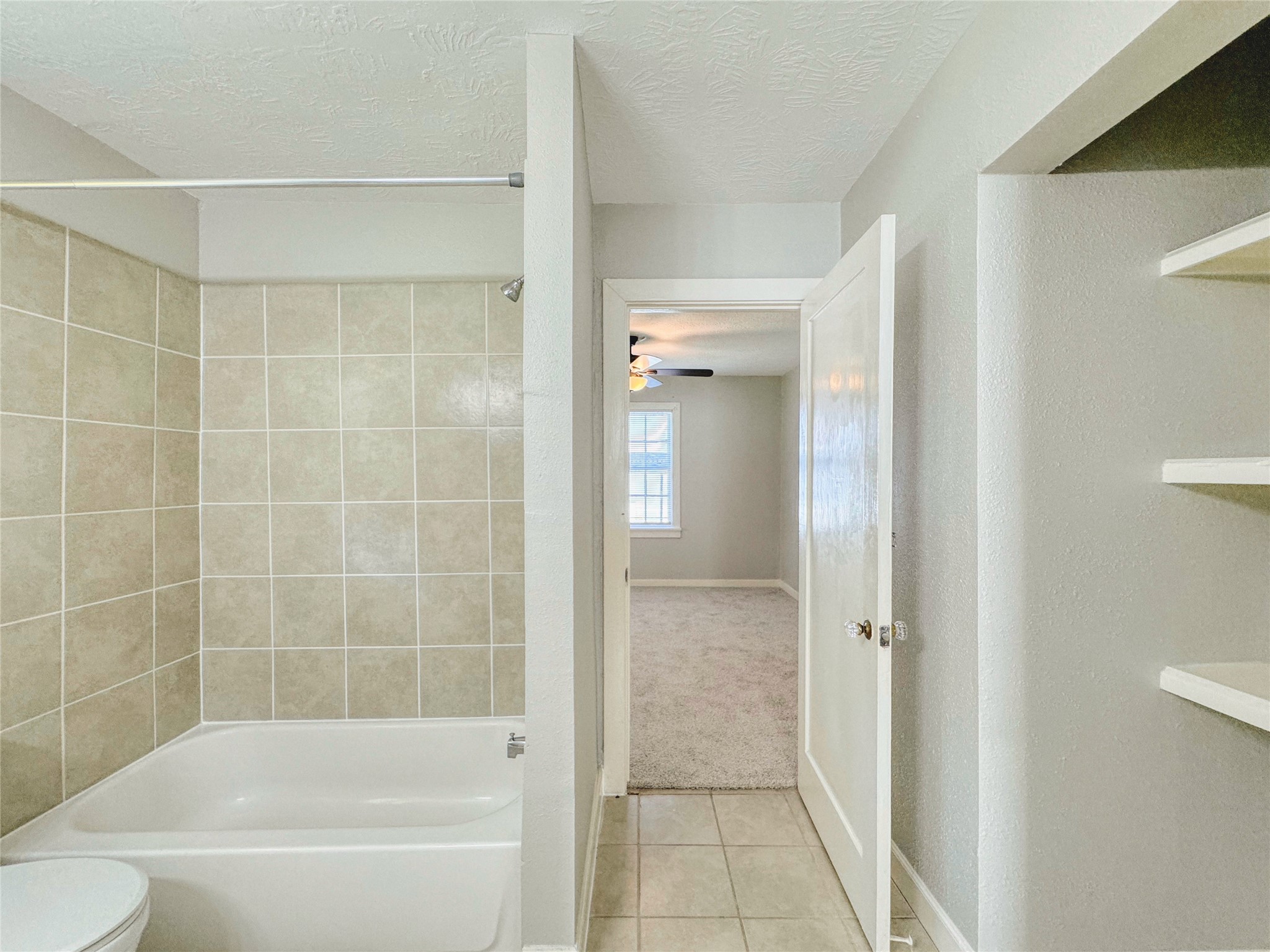 6714 Dillon Street Houston, TX 77061 - Photo 12 of 20 a bathroom with a bathtub and a shower