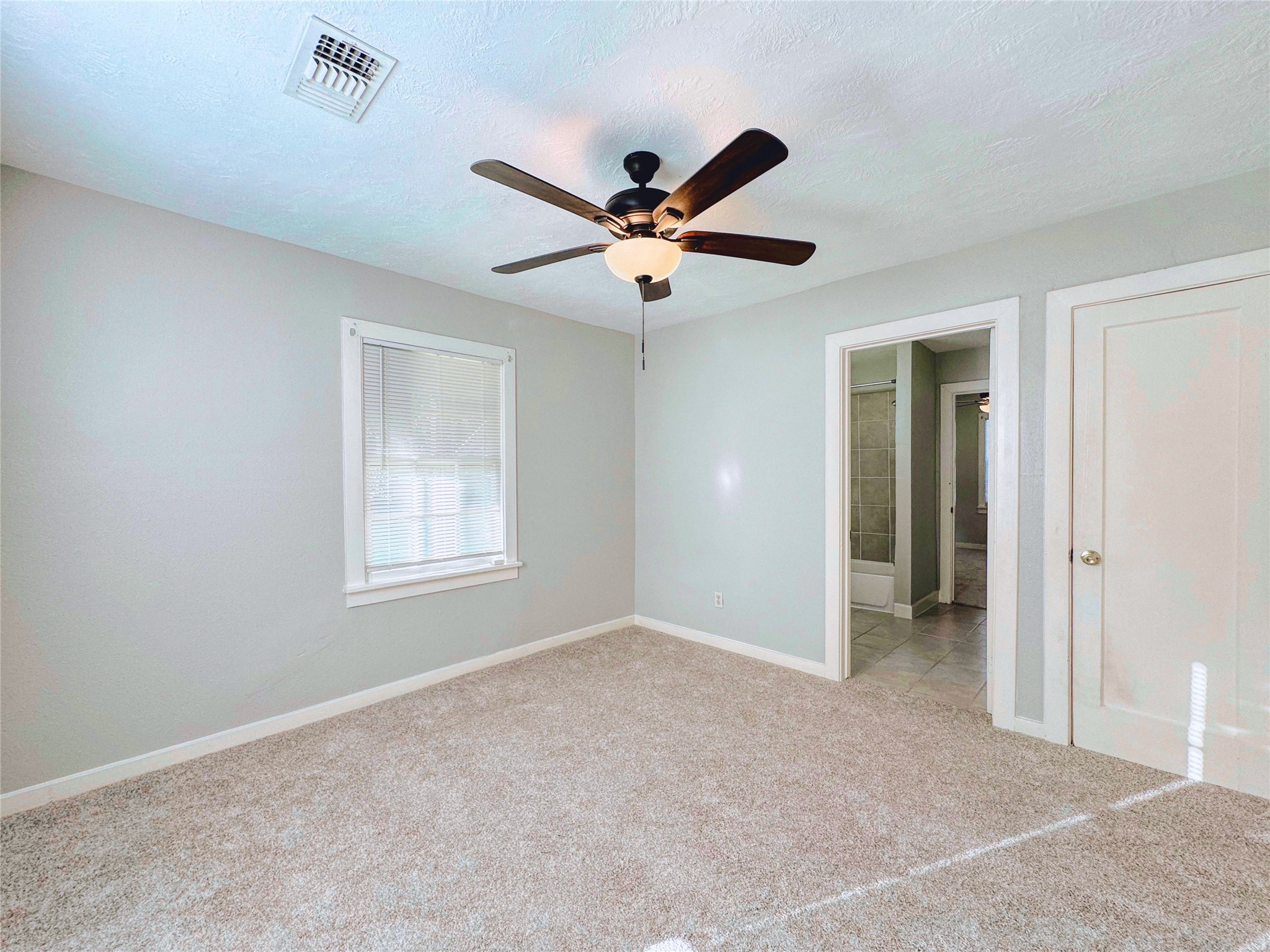 6714 Dillon Street Houston, TX 77061 - Photo 16 of 20 a view of a livingroom with a ceiling fan and window