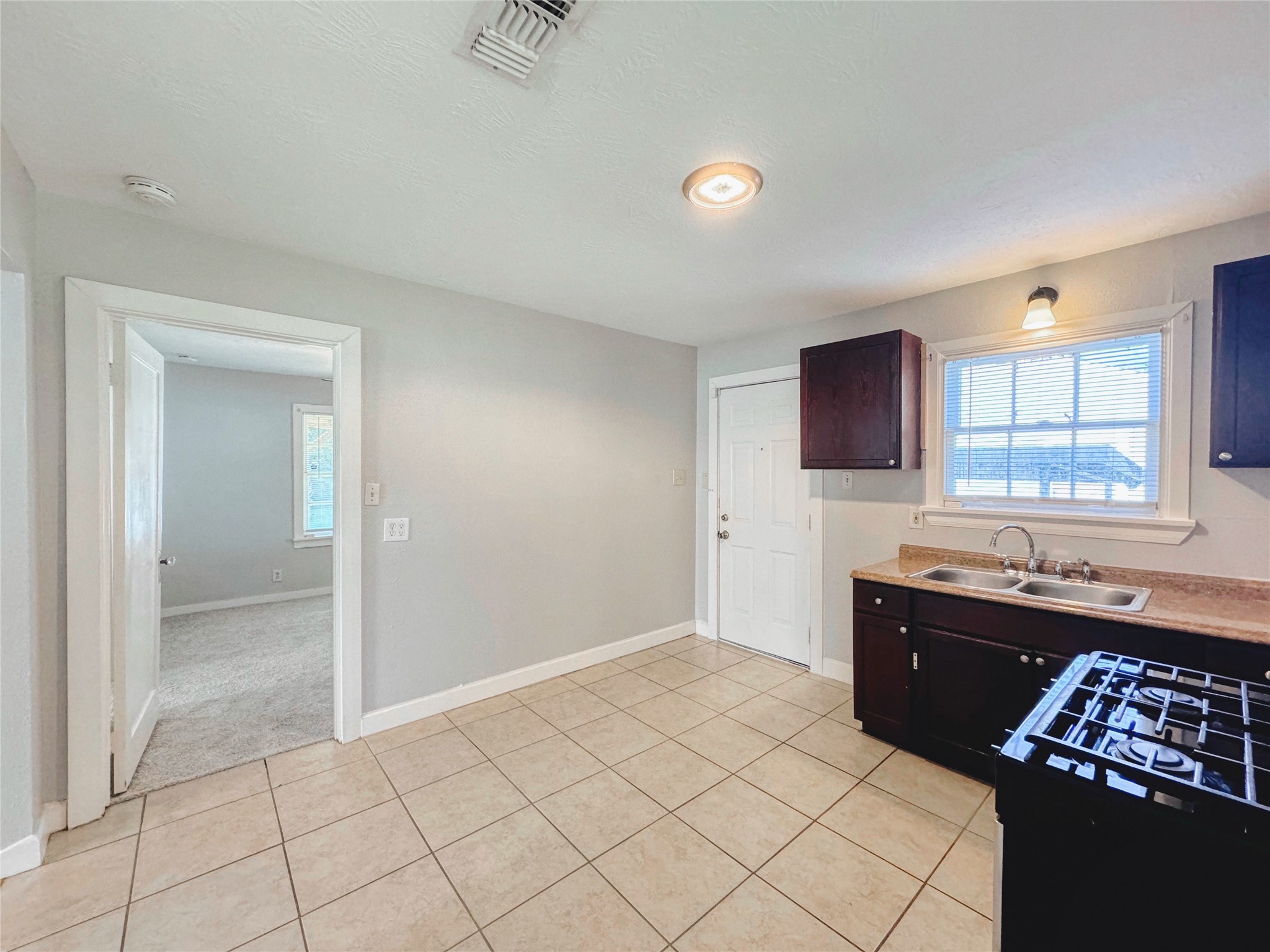 6714 Dillon Street Houston, TX 77061 - Photo 9 of 20 a spacious bathroom with a sink mirror and vanity