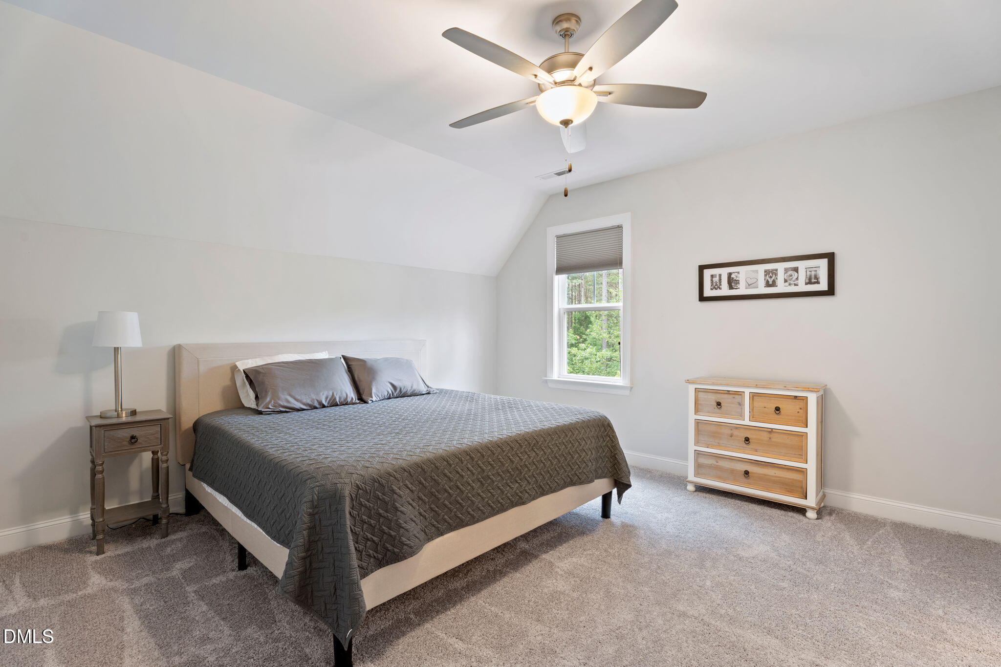 223 Colonial Ridge Drive Pittsboro, NC 27312 - Photo 30 of 47 a bedroom with a bed and a window