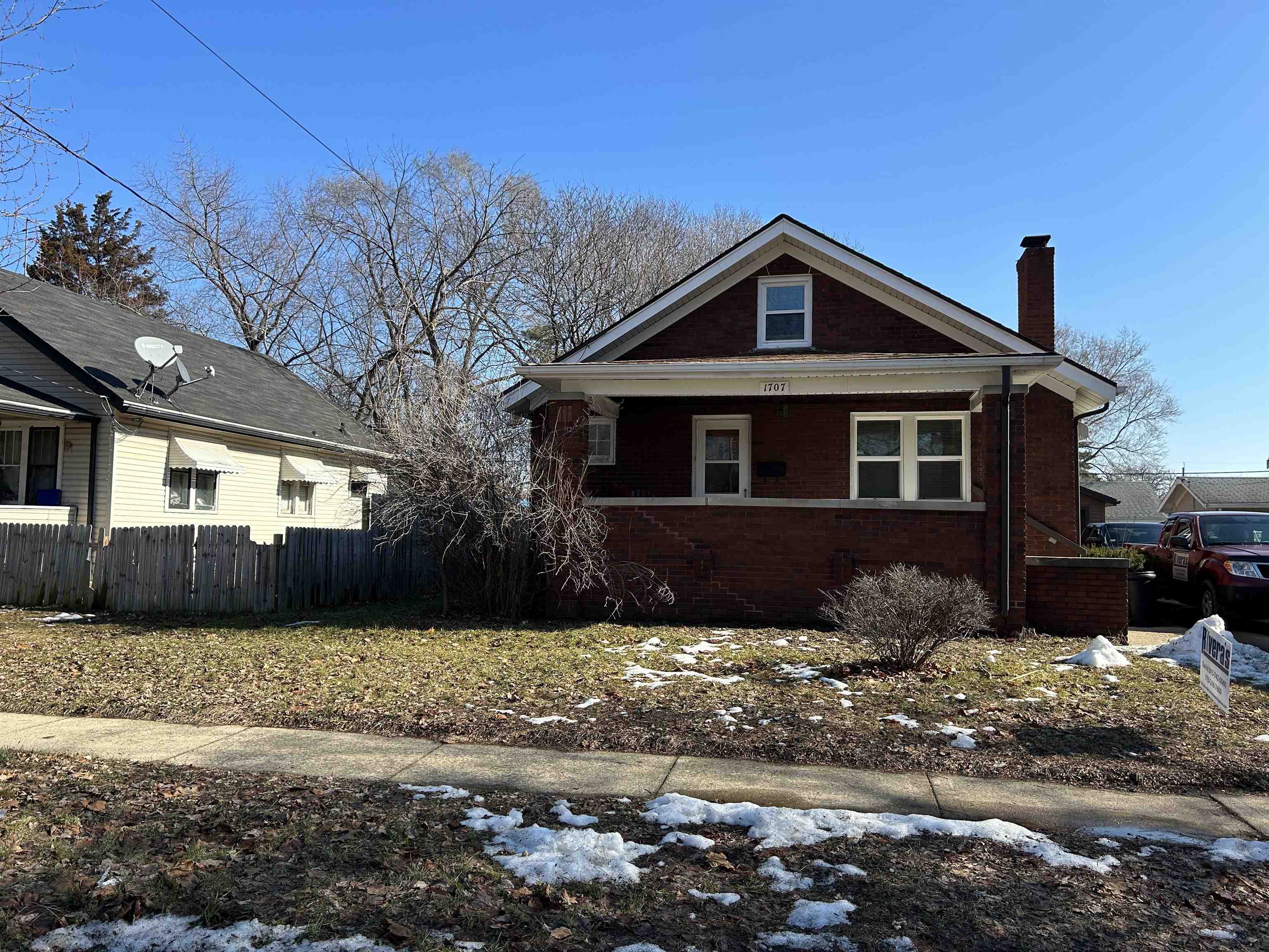 1707 Ridge Avenue Rockford, IL 61103 - Photo 1 of 33 a front view of a house with a yard