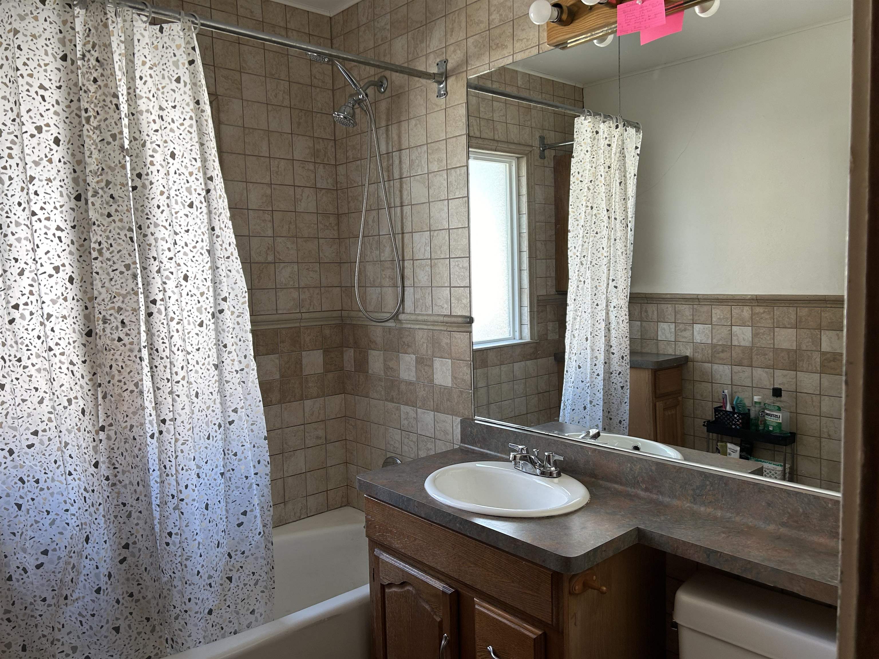1707 Ridge Avenue Rockford, IL 61103 - Photo 11 of 33 a bathroom with a sink and a mirror