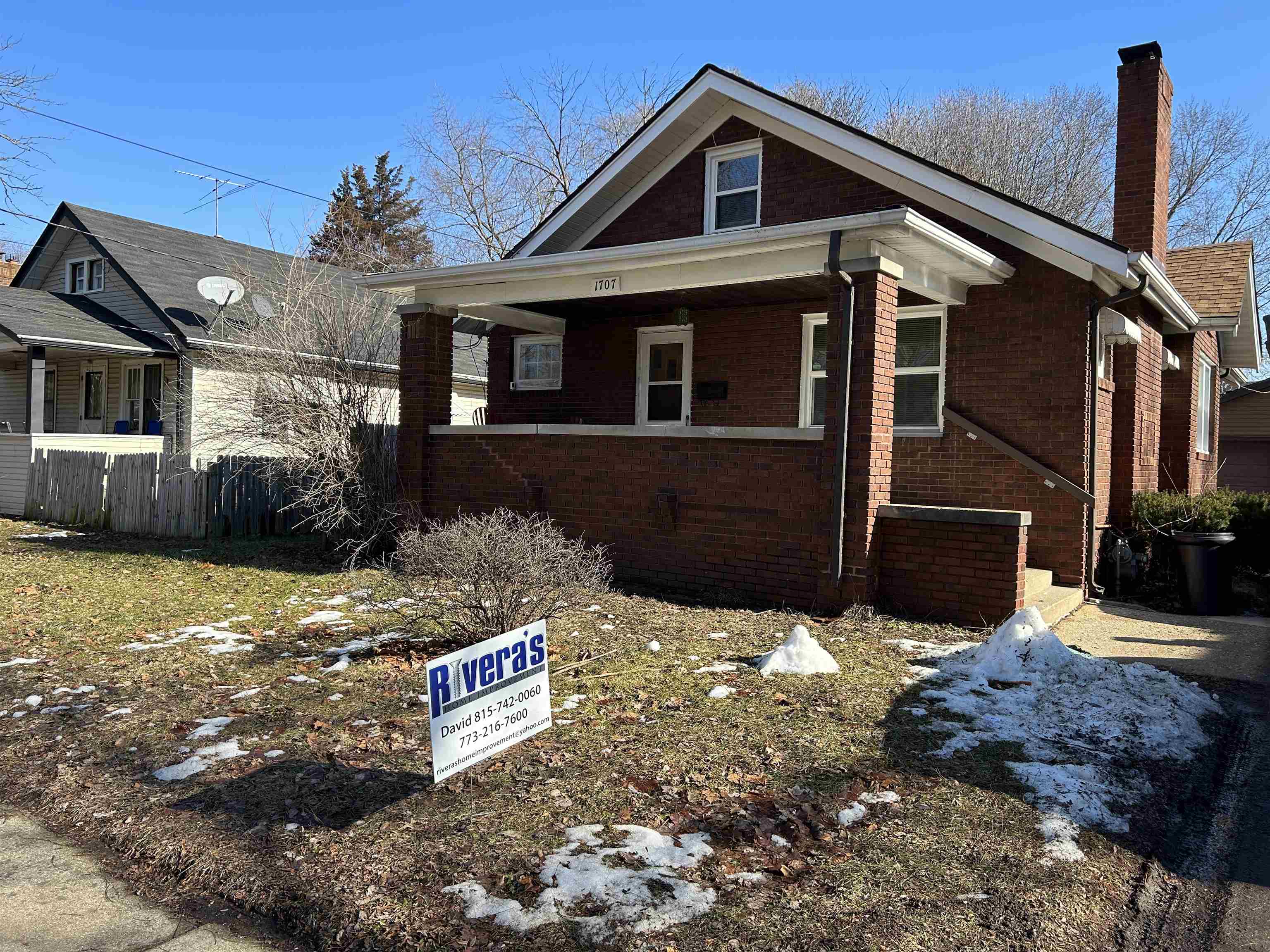 1707 Ridge Avenue Rockford, IL 61103 - Photo 2 of 33 a front view of a house with a yard