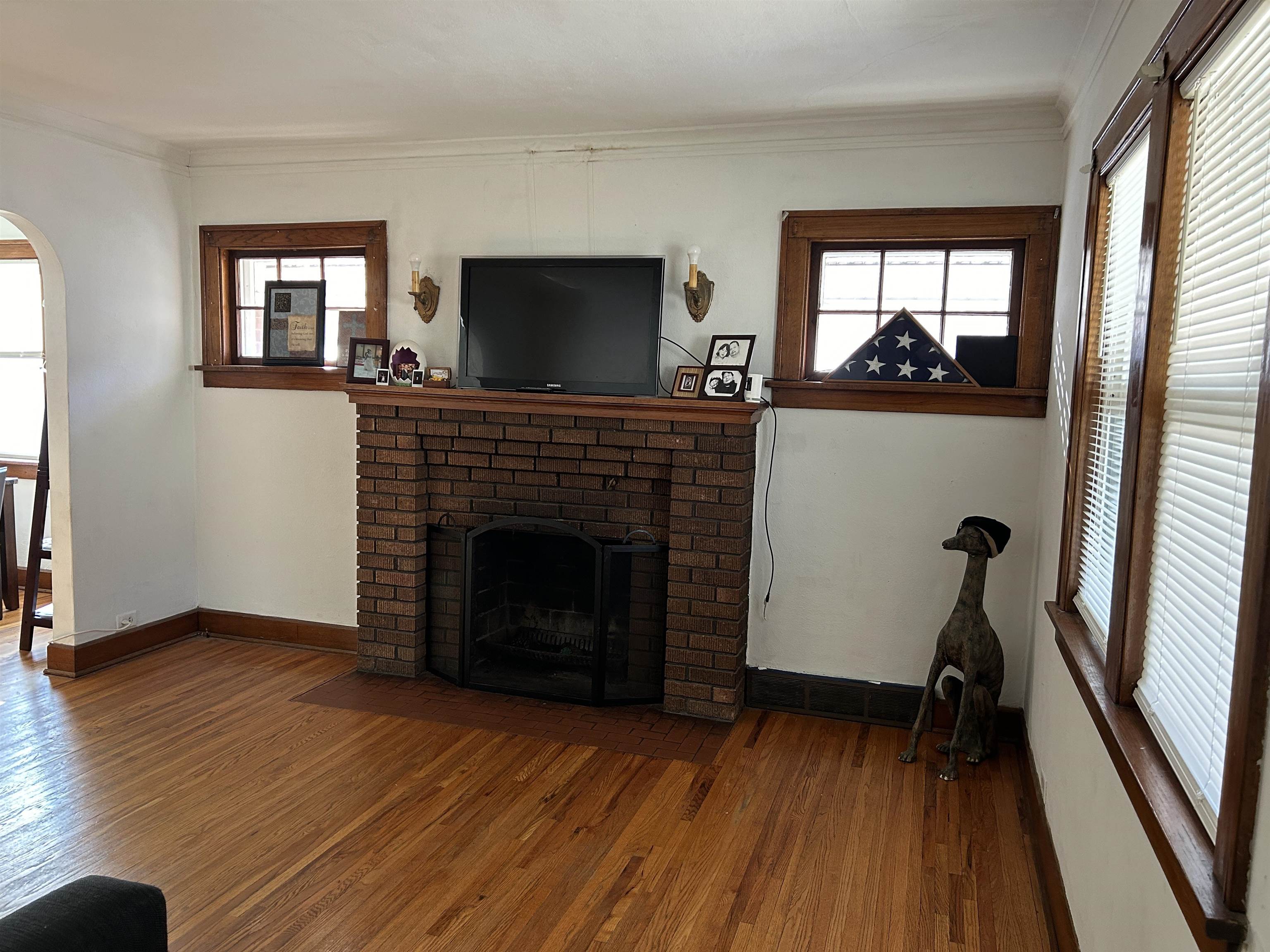 1707 Ridge Avenue Rockford, IL 61103 - Photo 4 of 33 a living room with a fireplace and a flat screen tv