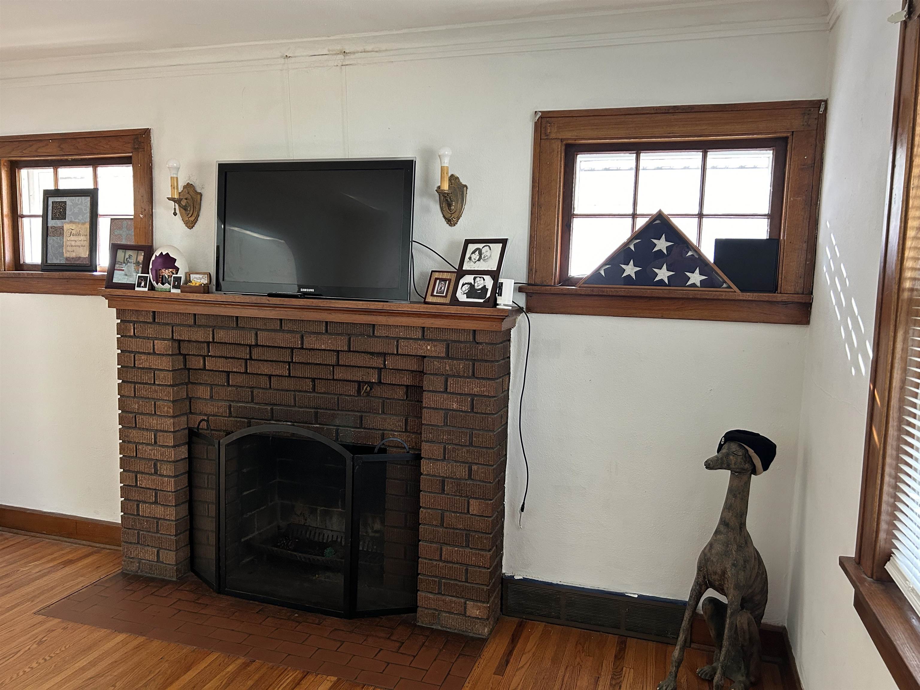 1707 Ridge Avenue Rockford, IL 61103 - Photo 5 of 33 a living room with a fireplace and a flat screen tv