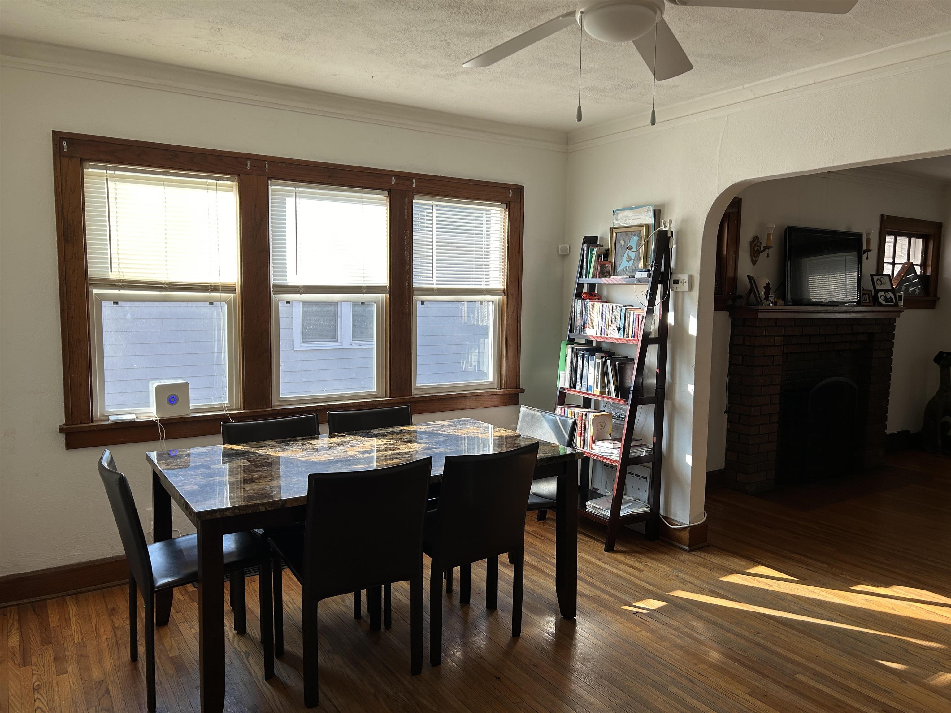 1707 Ridge Avenue Rockford, IL 61103 - Photo 7 of 33 a dining room with a table chairs and a kitchen view