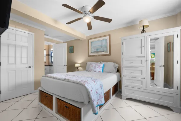 a kitchen with stainless steel appliances granite countertop a sink dishwasher and a refrigerator with wooden floor