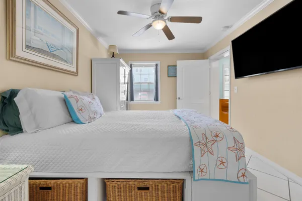 a spacious bedroom with a bed a window and walk in closet