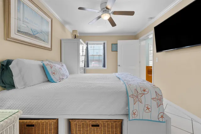 a spacious bedroom with a bed a window and walk in closet