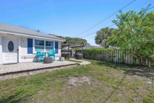 a bathroom with a granite countertop toilet a sink and a bathtub