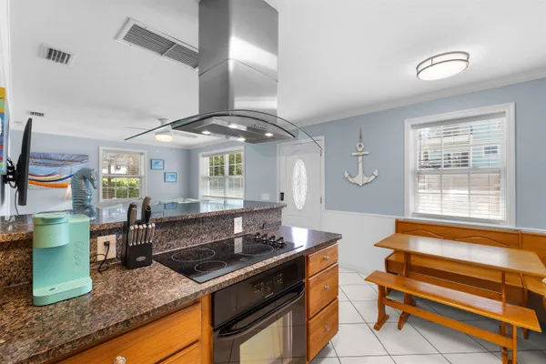 a open kitchen with cabinets a sink and appliances