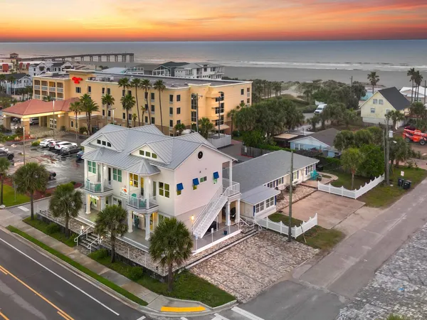 a view of a house with a yard and deck