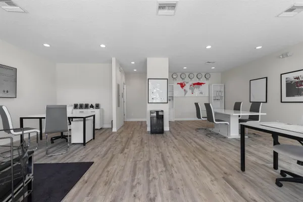 a living room with furniture a large window and a flat screen tv