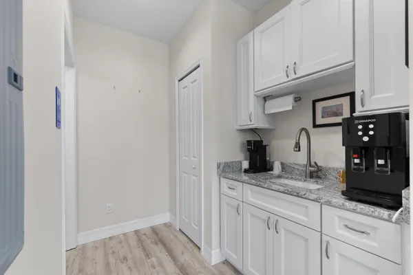a stove top oven sitting inside of a kitchen