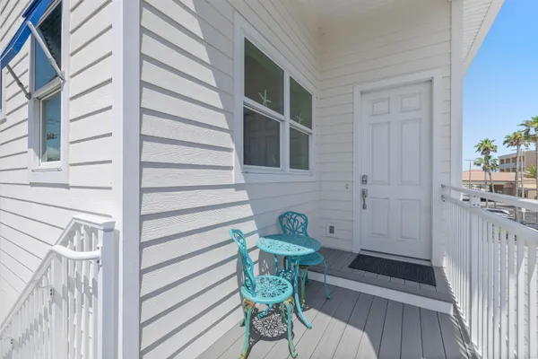 a view of a house with a yard and large trees