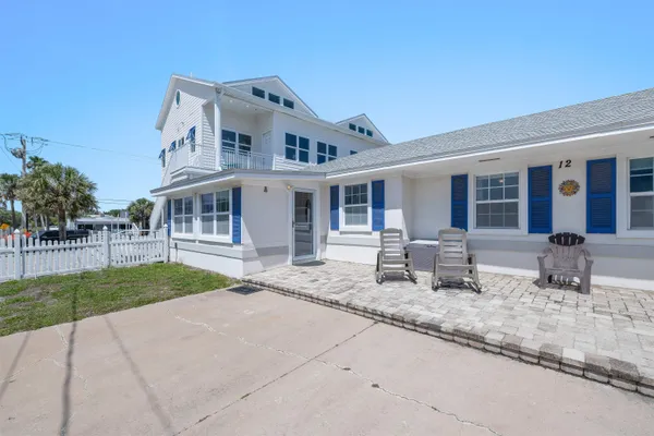 a bedroom with a bed and a ceiling fan