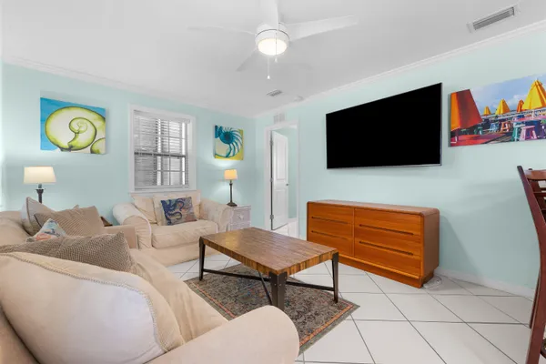 a bathroom with a granite countertop sink a toilet a mirror and shower
