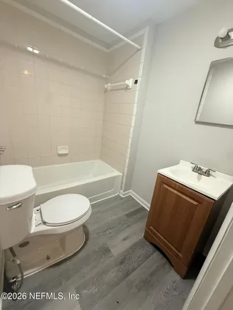 a bathroom with a toilet a sink and bathtub