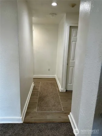 a bathroom with a toilet and a shower curtain