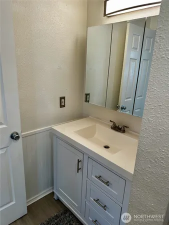 a view of room with wooden floor and window