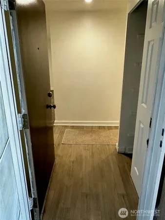 an empty room with wooden floor