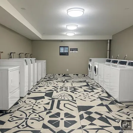 a view of a bedroom with furniture