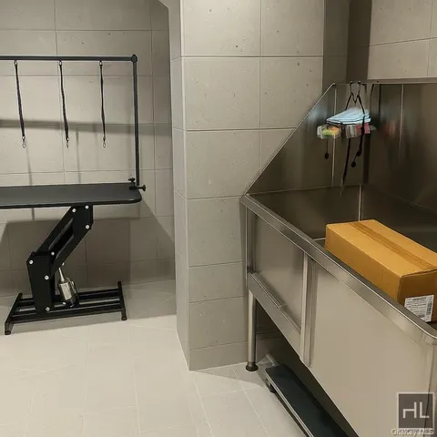 a bathroom with a sink and a window