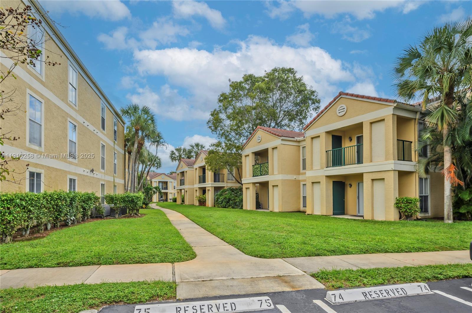 833 Riverside Drive, Unit 811 Coral Springs, FL 33071 - Photo 17 of 21 a front view of a house with a yard