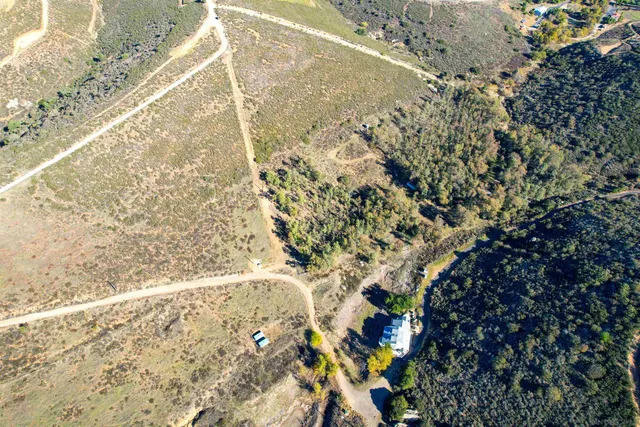 a view of a yard with a mountain
