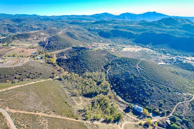 a view of a mountain from a yard
