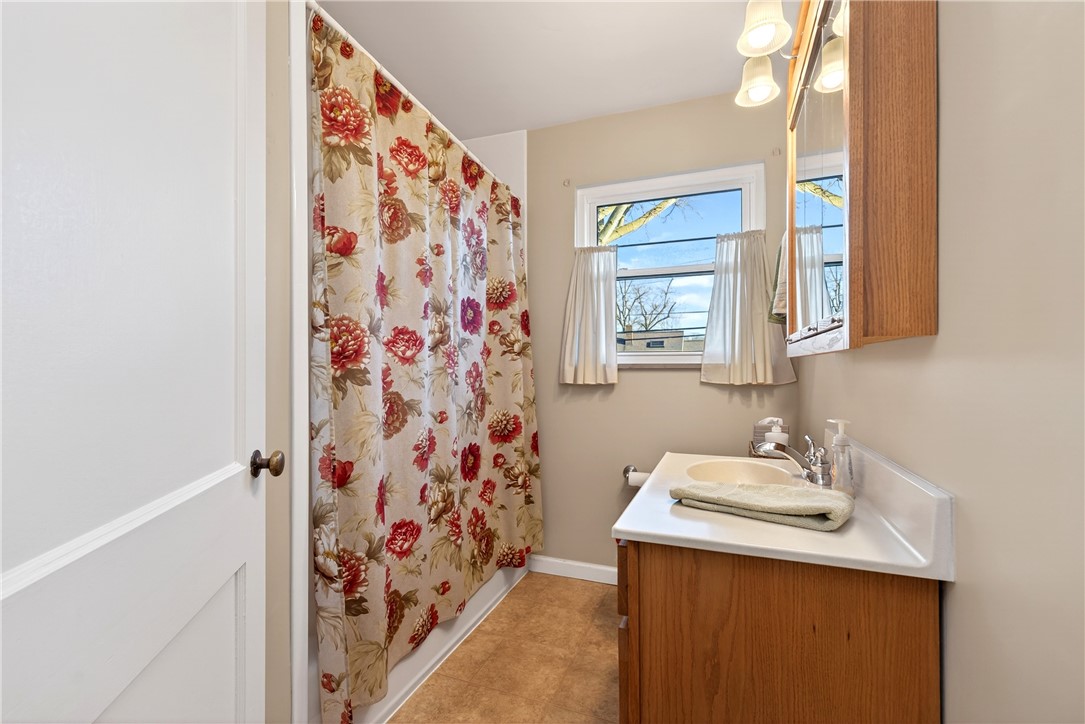 1237 Laurelwood Road Dayton, OH 45409 - Photo 20 of 56 This bathroom features a functional vanity with ample counter space and a bright window.
