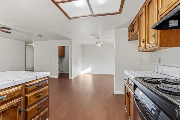 a kitchen that has a stove and a table