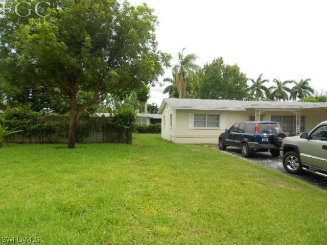 1424 Mandel Road Fort Myers, FL 33919 - Photo 3 of 15 a view of house with backyard and slide