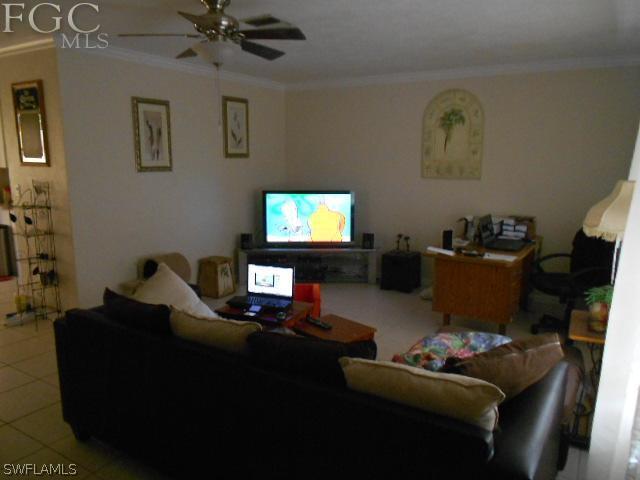 1424 Mandel Road Fort Myers, FL 33919 - Photo 5 of 15 a living room with furniture and a flat screen tv