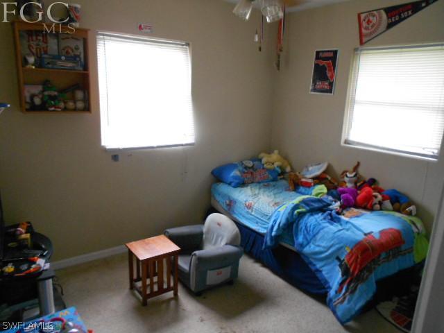 1424 Mandel Road Fort Myers, FL 33919 - Photo 10 of 15 a bedroom with a bed and a window