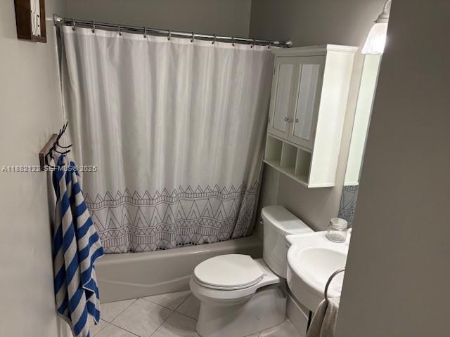 19420 Southwest 307th Street Homestead, FL 33030 - Photo 13 of 17 a white toilet sitting next to a shower curtain