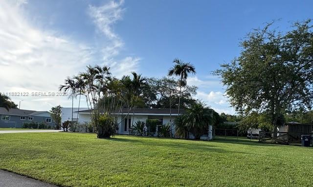 19420 Southwest 307th Street Homestead, FL 33030 - Photo 16 of 17 a big yard with palm trees
