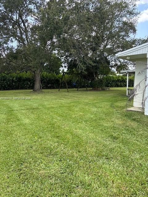 19420 Southwest 307th Street Homestead, FL 33030 - Photo 4 of 17 a view of a field of grass and trees